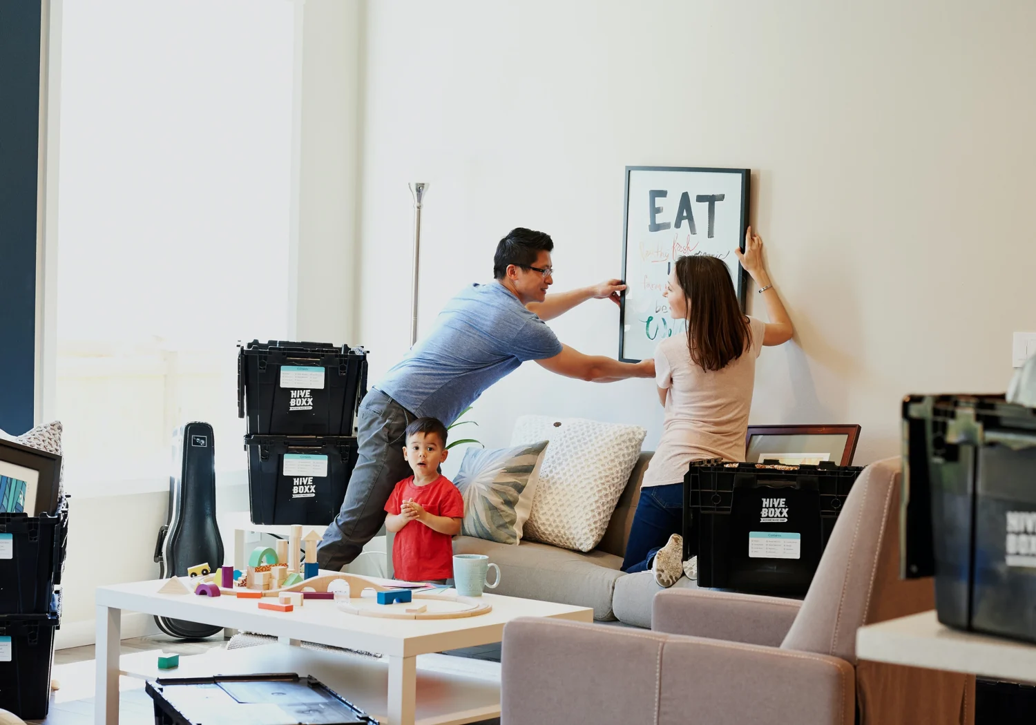 A family in a home in Dripping Springs, Texas, moving in after electric servicing from PowerMeans Electricians.