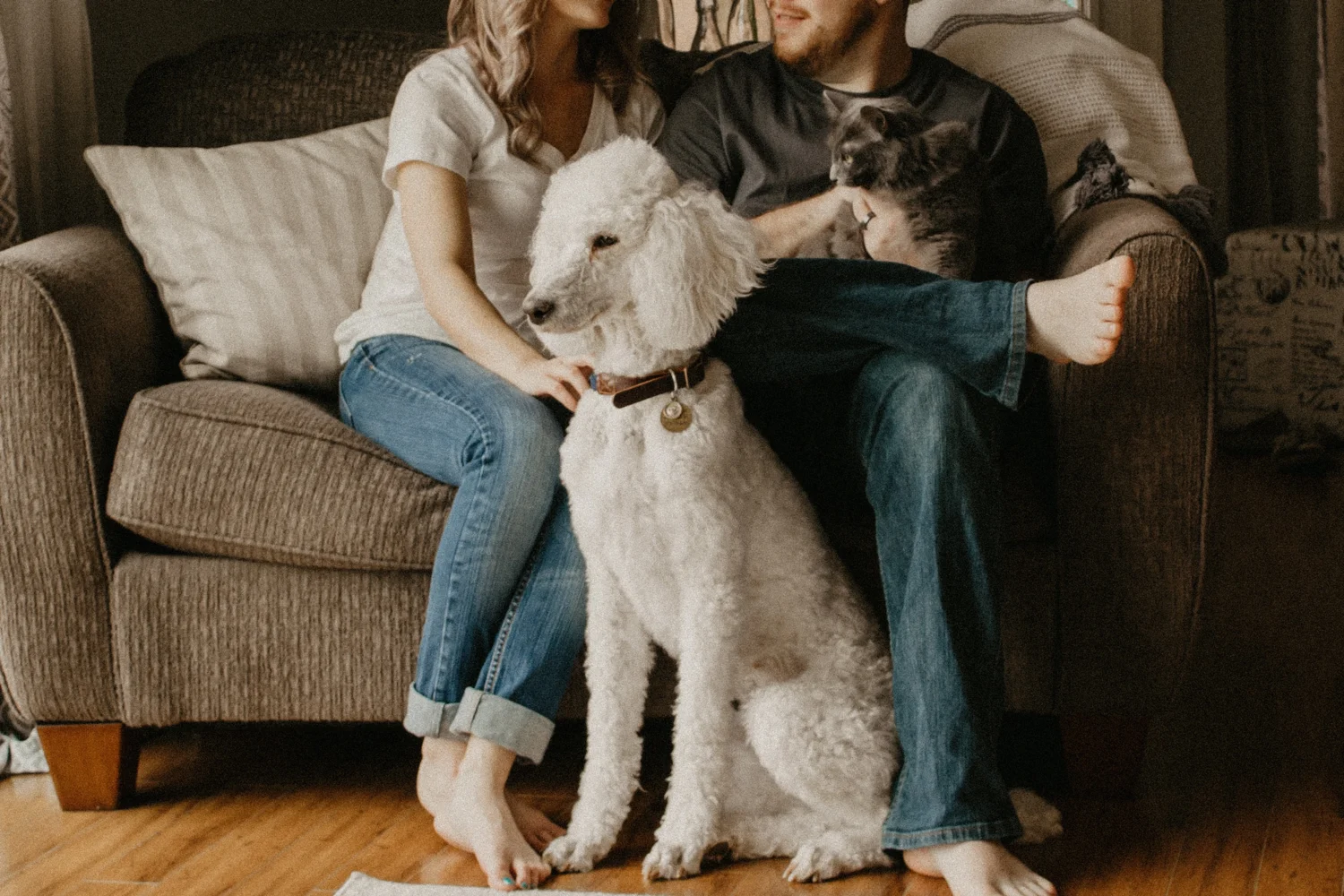 A family enjoying time with their pet in their Hays, Texas home