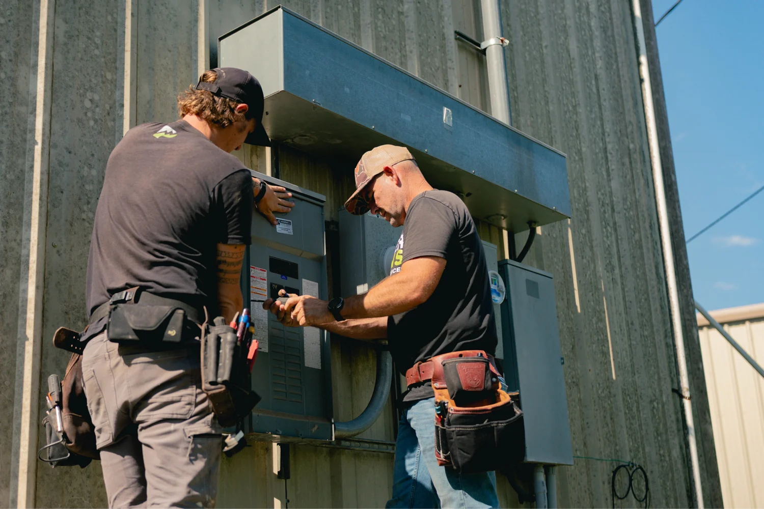 Licensed electrician performing an electrical inspection in a home in Dripping Springs, Texas