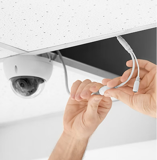 PowerMeans Employee Connecting A Security Camera