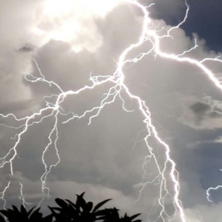A storm in Dripping Springs, Texas, near a serviced PowerMeans Electric home.