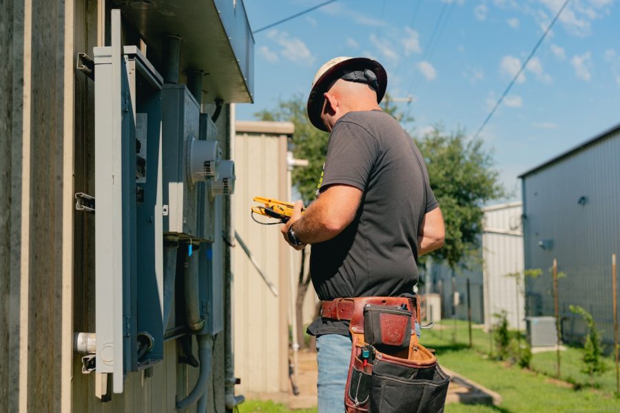 Licensed electrician inspecting a subpanel upgrade in Austin, TX home